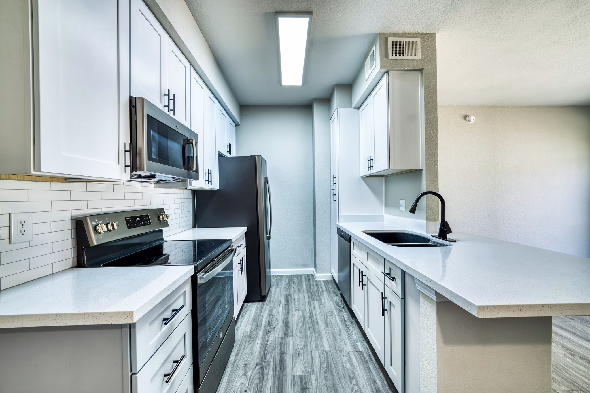 Modern kitchen with stainless steel appliances at Hayden Park Apartments