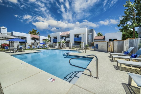 Luxury pool with lounge seating at Hayden Park Apartments