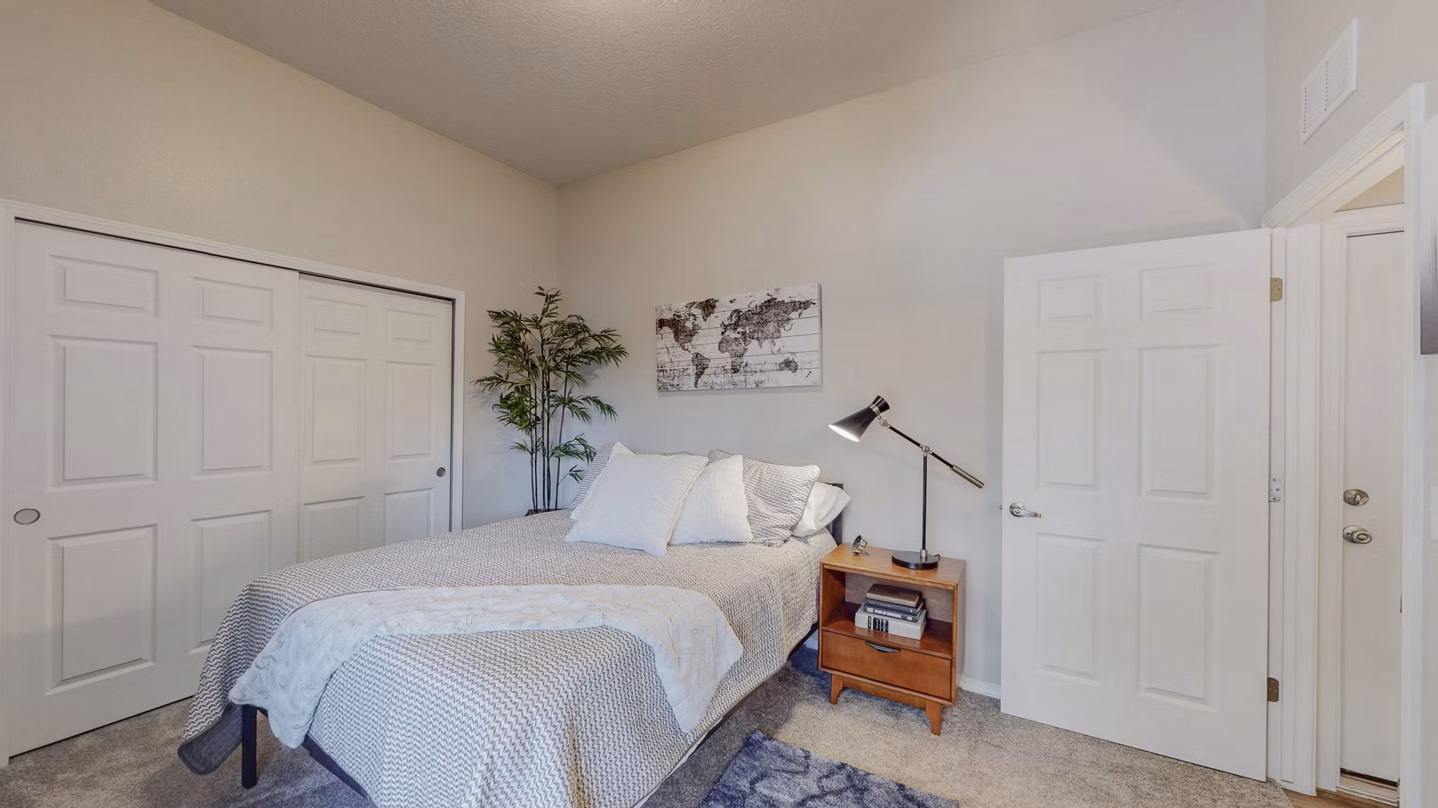 Spacious bedroom with modern decor in Cantata at the Trails Apartments - Greystar luxury living