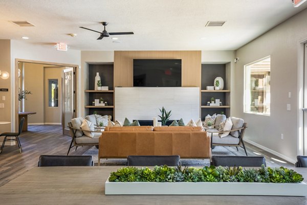 Cantata at the Trails Apartments: Modern clubhouse featuring elegant seating areas and community space