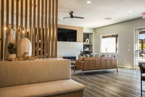 Expansive clubhouse featuring modern design and seating areas at Cantata at the Trails Apartments