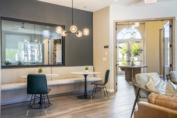 Modern clubhouse with elegant seating and fireplace at Cantata at the Trails luxury apartments