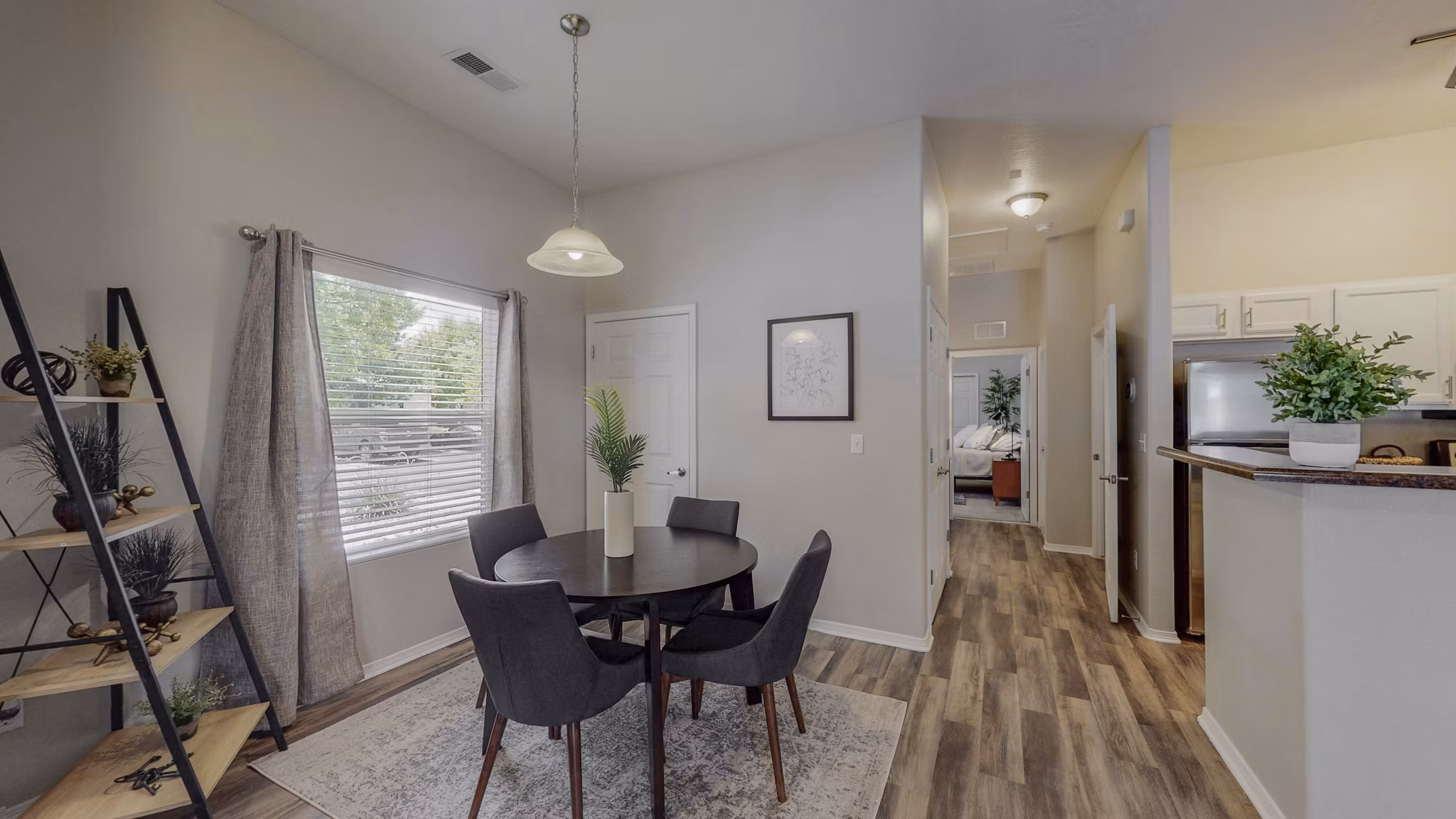 Dining area featuring modern furniture and open layout in Cantata at the Trails Apartments