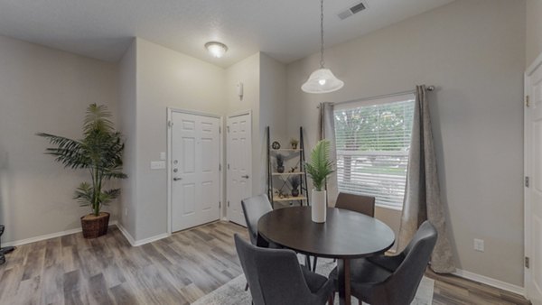 Dining area with modern decor at Cantata at the Trails luxury apartments, ideal for gatherings and stylish living