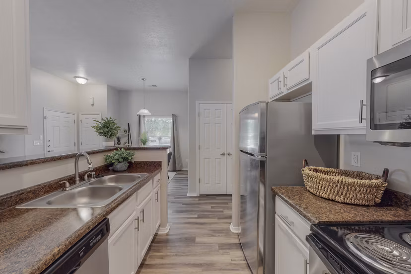 Modern kitchen with stainless steel appliances at Cantata at the Trails Apartments, offering luxury living in a stylish setting