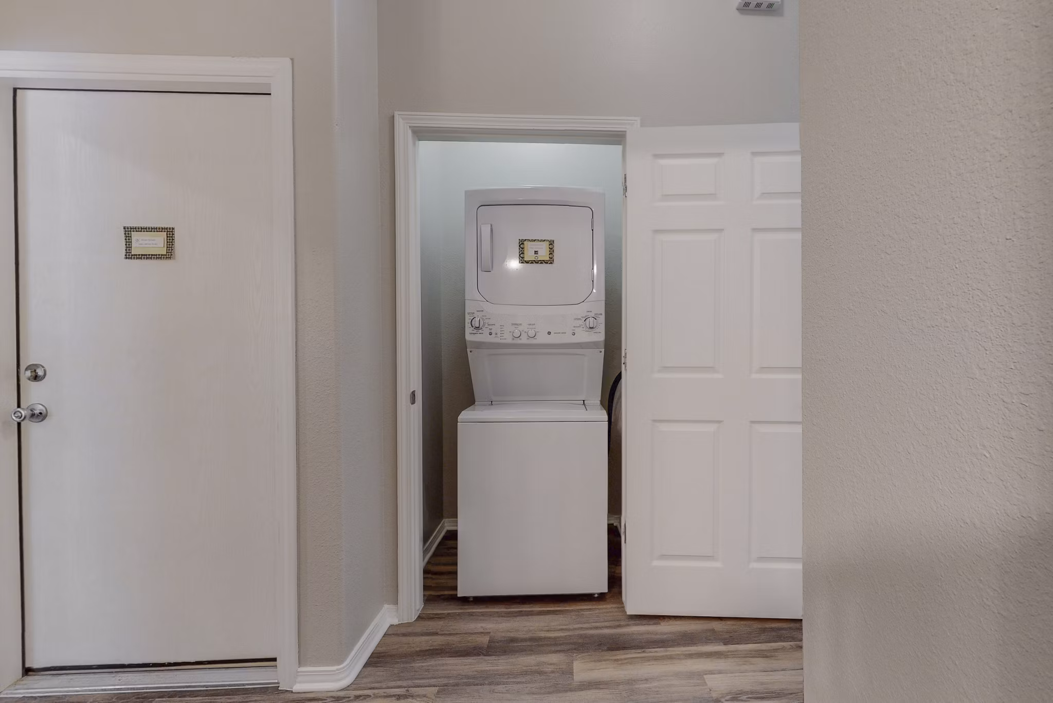 Laundry room featuring state-of-the-art appliances at Cantata at the Trails Apartments
