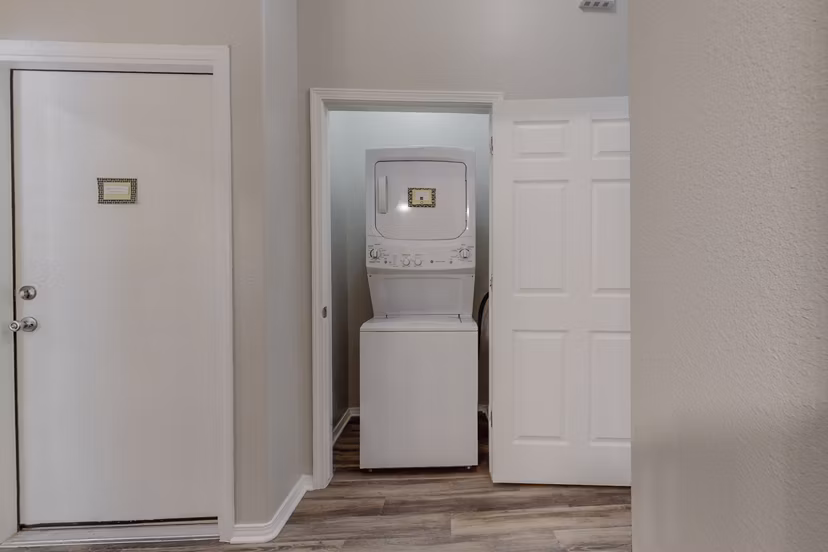 Laundry room featuring state-of-the-art appliances at Cantata at the Trails Apartments