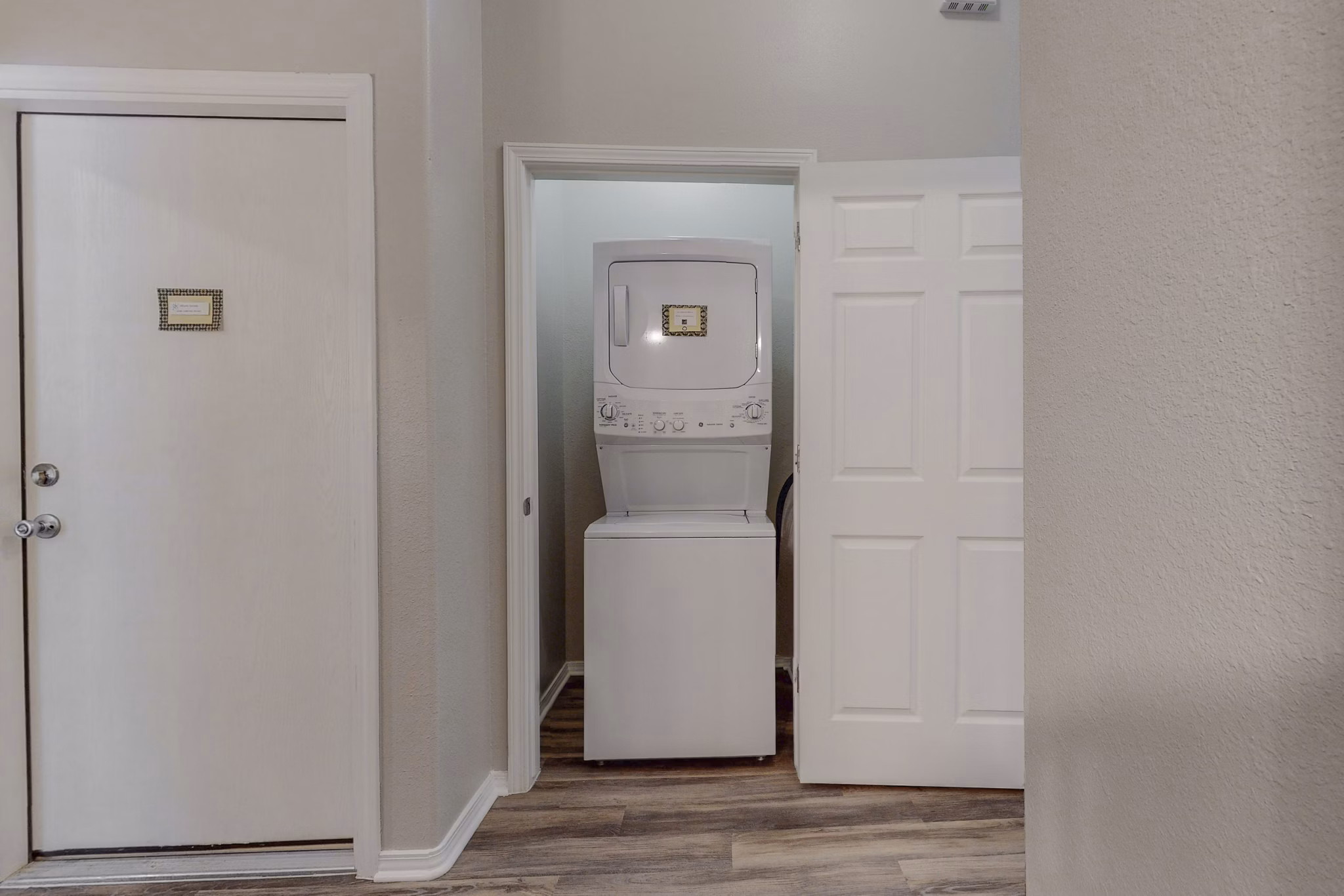 Laundry room featuring state-of-the-art appliances at Cantata at the Trails Apartments