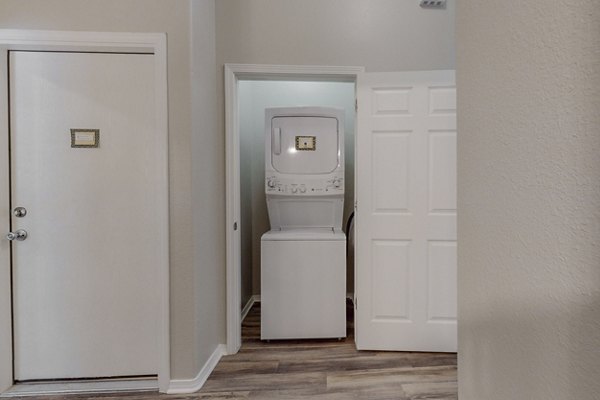 Laundry room featuring state-of-the-art appliances at Cantata at the Trails Apartments