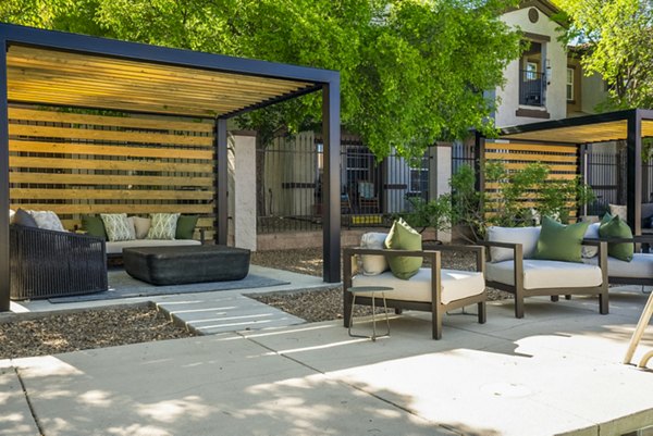 Patio with modern outdoor furniture at Cantata at the Trails Apartments, offering luxury outdoor living spaces