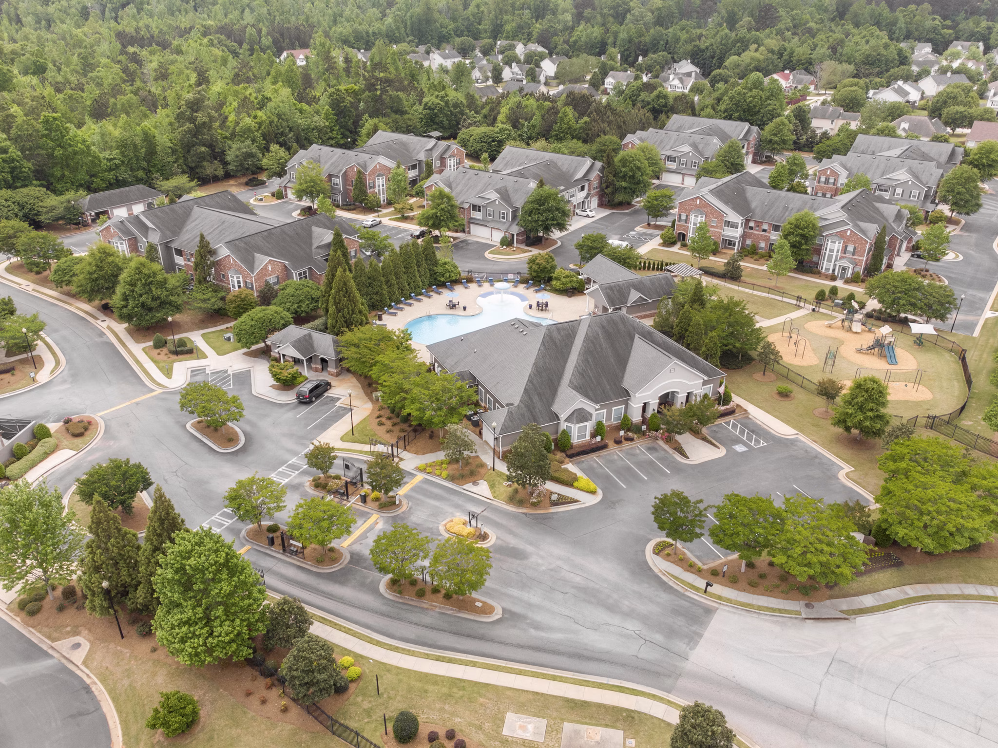 Mandalay Villas: Elegant view of luxury apartments in McDonough, showcasing architectural style and lush landscaping