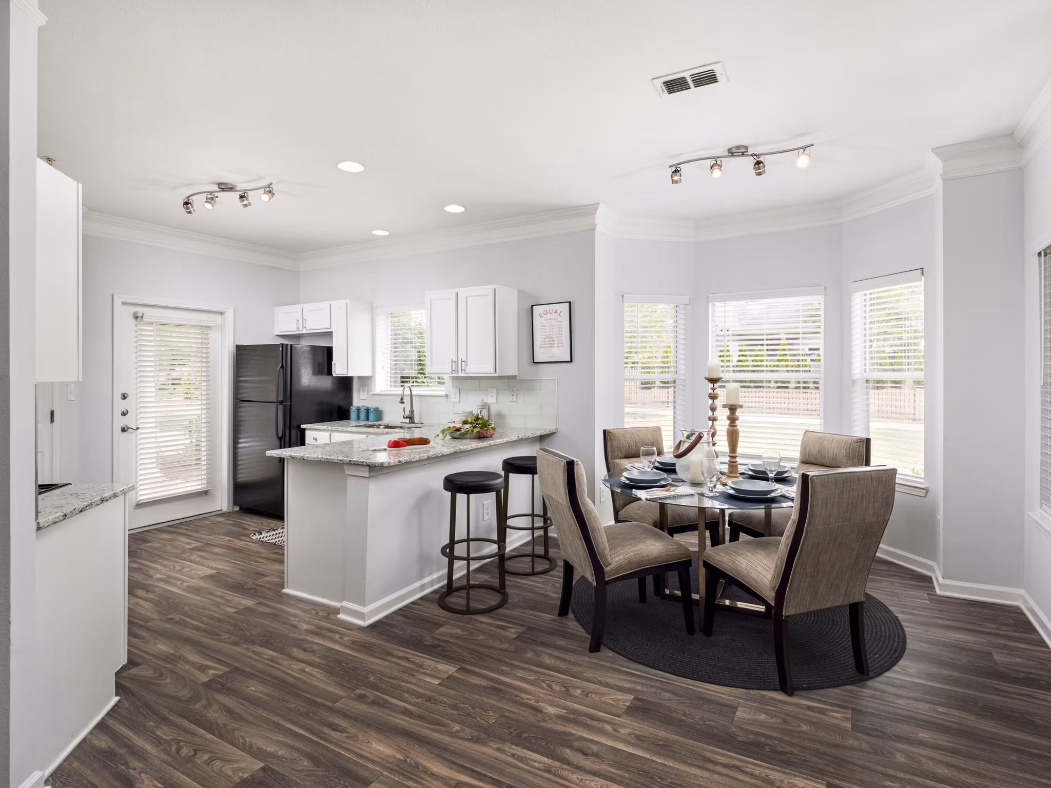 Dining room with modern decor and elegant lighting at Mandalay Villas Apartments, luxury living in a serene environment