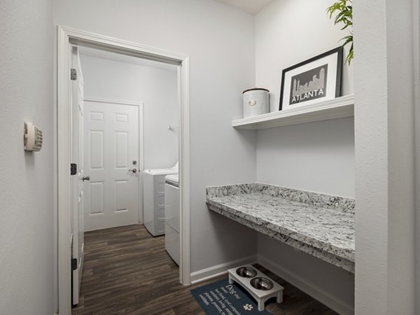 Laundry room with advanced appliances at Mandalay Villas Apartments