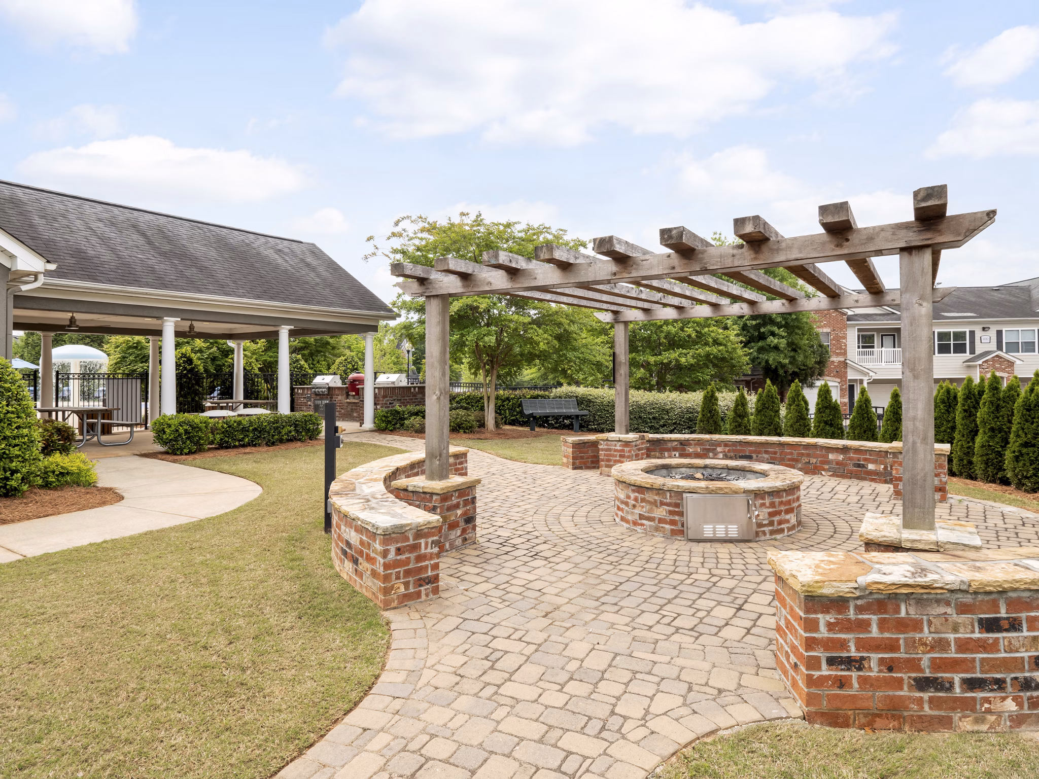 Courtyard with cozy fire pit at Mandalay Villas Apartments, ideal for luxury outdoor relaxation and social gatherings