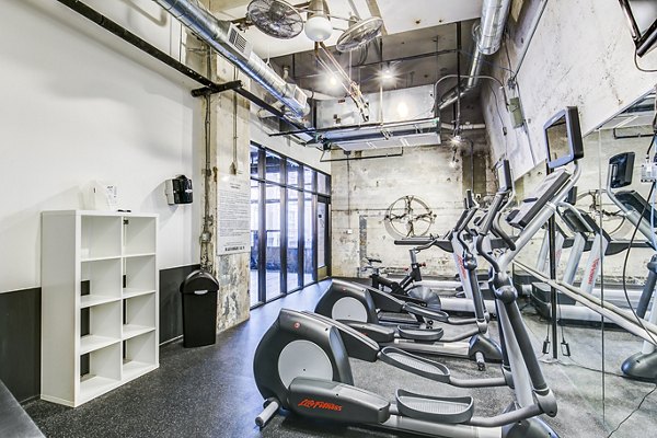 State-of-the-art fitness center with modern equipment at Interurban Building Apartments, ideal for residents seeking an active lifestyle