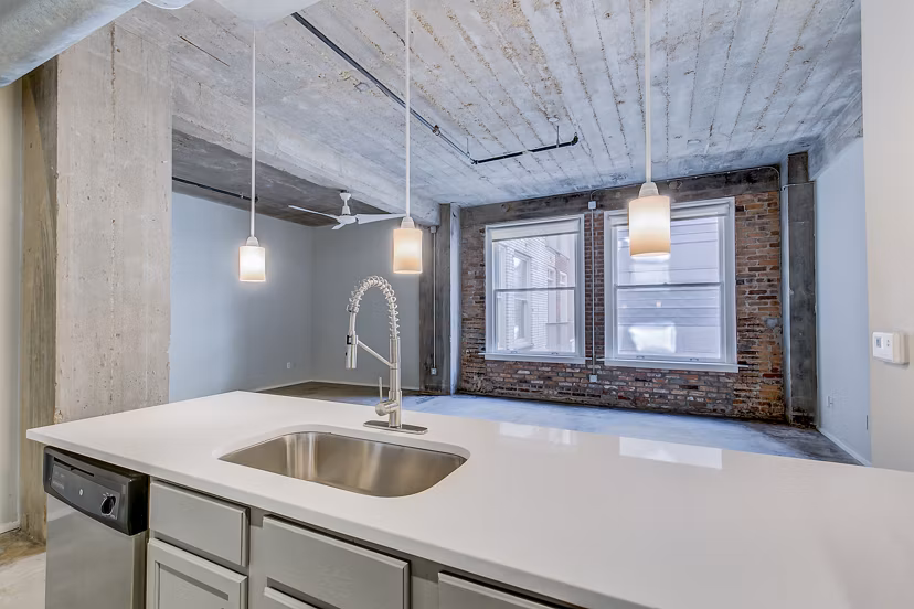 Modern kitchen with stainless steel appliances at Interurban Building Apartments, a luxury residence by Greystar
