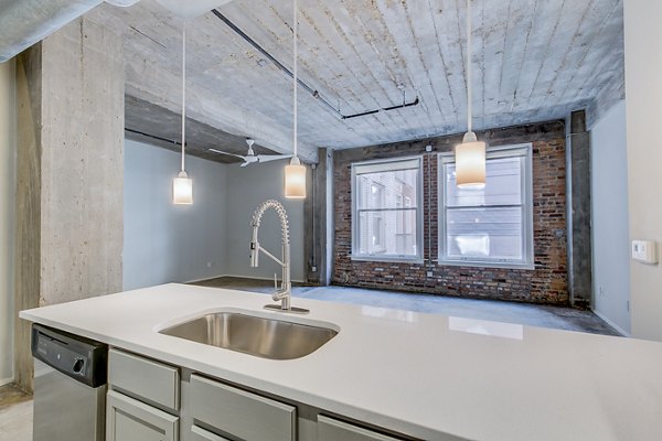 Modern kitchen with stainless steel appliances at Interurban Building Apartments, a luxury residence by Greystar