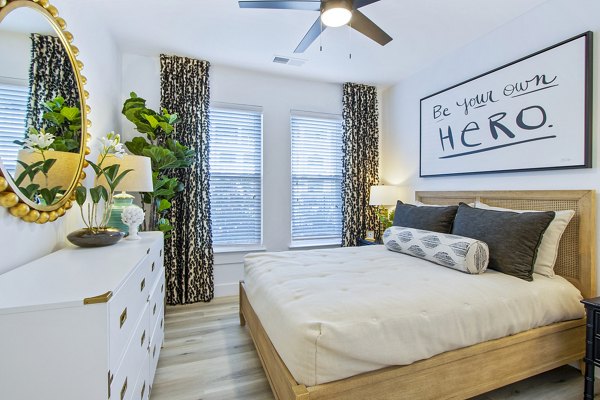 Modern bedroom with elegant decor at 1000 West Apartments: luxury living offered by Greystar