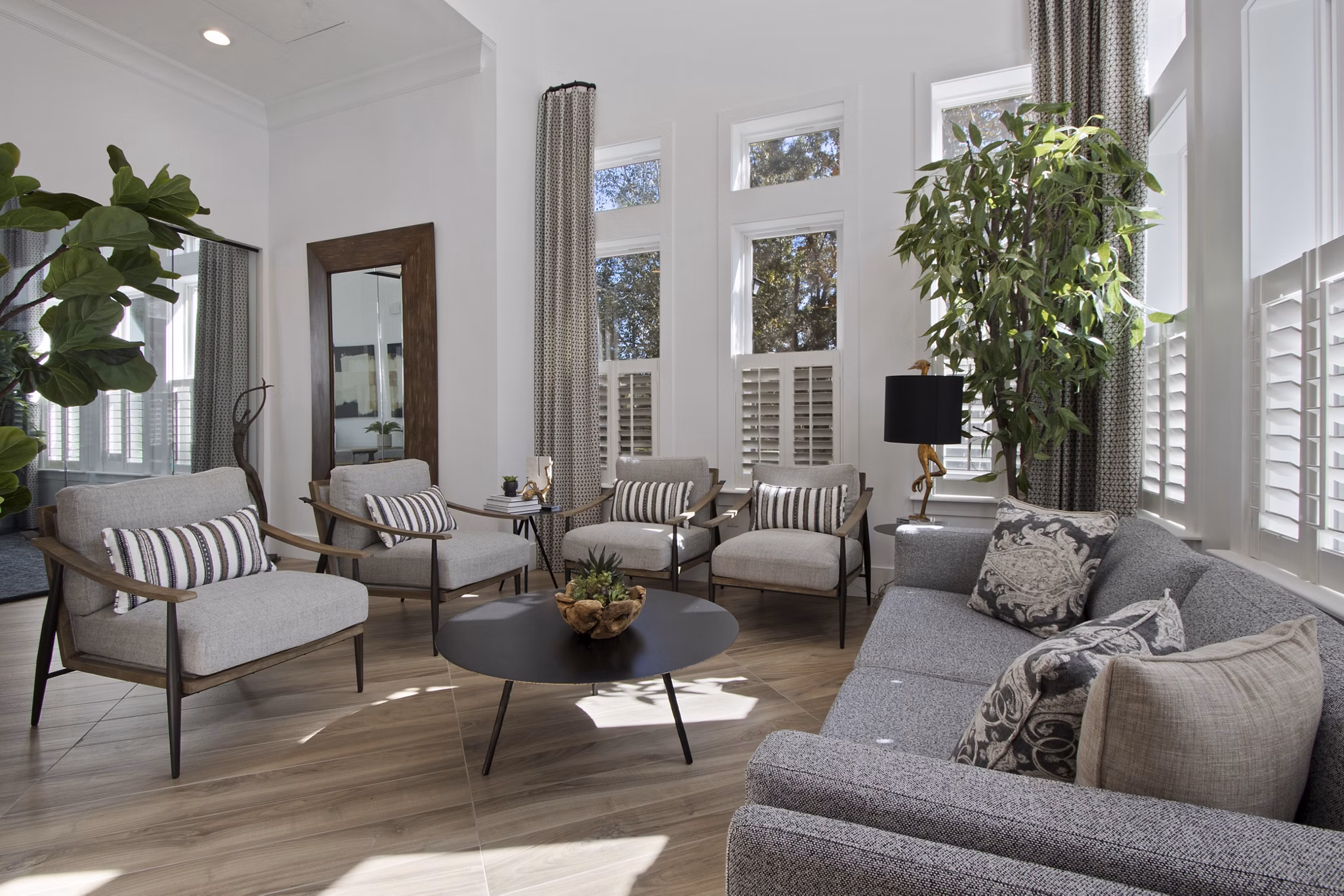 Spacious clubhouse with modern seating and decor in 1000 West Apartments lobby