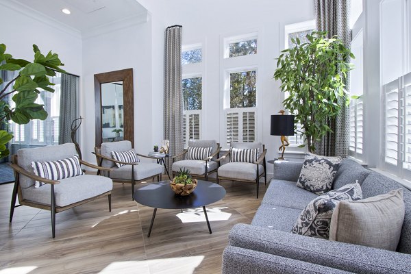 Spacious clubhouse with modern seating and decor in 1000 West Apartments lobby