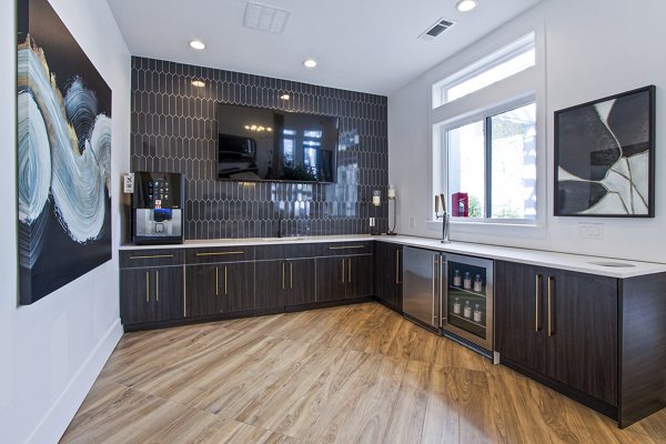 Elegant clubhouse with modern decor in 1000 West Apartments lobby, providing a luxurious and welcoming atmosphere for residents