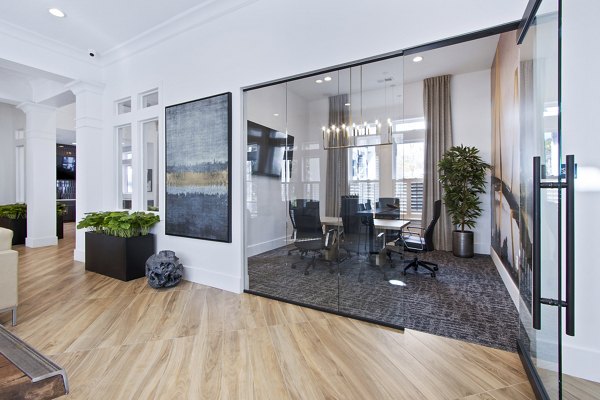 Modern clubhouse meeting facility at 1000 West Apartments featuring spacious seating and state-of-the-art technology