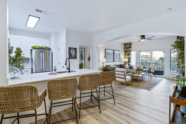 Modern kitchen with stainless steel appliances at 1000 West Apartments, offering luxury living in a prime location