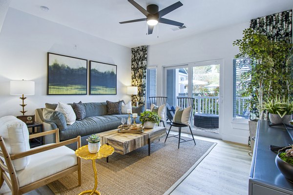 Living room featuring contemporary design and open layout at 1000 West Apartments