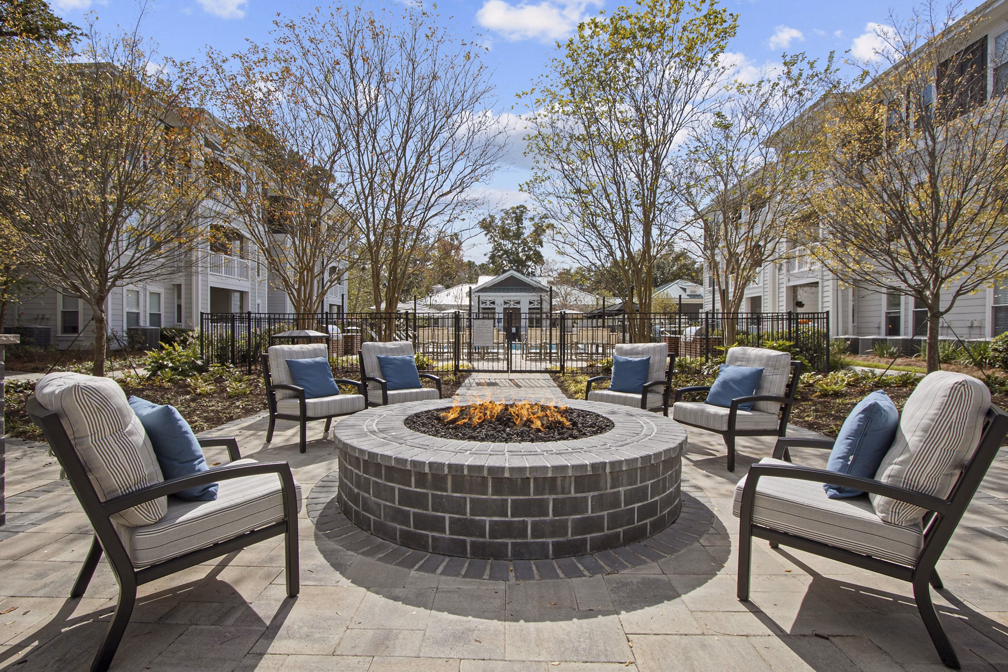 Chic outdoor patio with cozy fire pit at 1000 West Apartments, a luxury property by Greystar