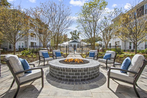 Chic outdoor patio with cozy fire pit at 1000 West Apartments, a luxury property by Greystar
