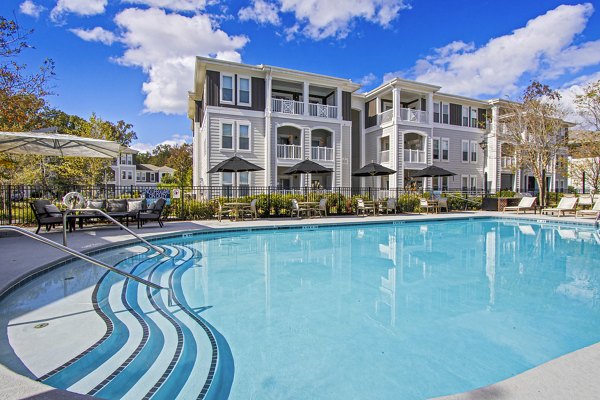 Luxury rooftop pool with city views at 1000 West Apartments