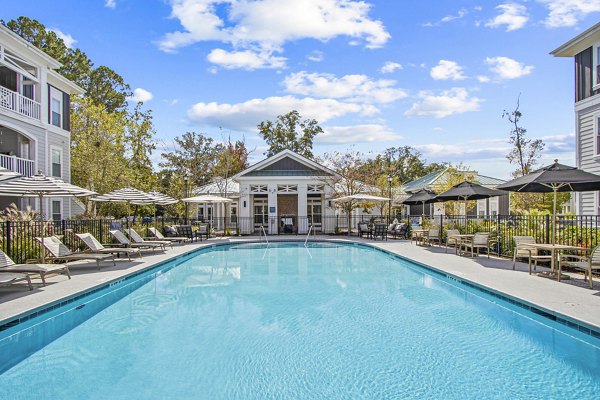 Luxurious outdoor pool surrounded by lush landscaping at 1000 West Apartments