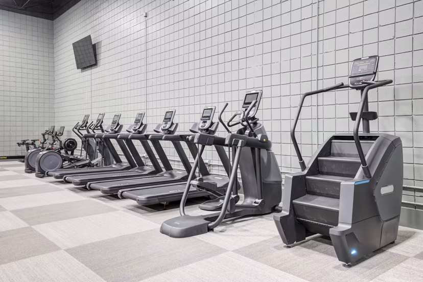 State-of-the-art fitness center at Mallard Crossing at St Matthews Apartments with modern equipment and spacious workout area