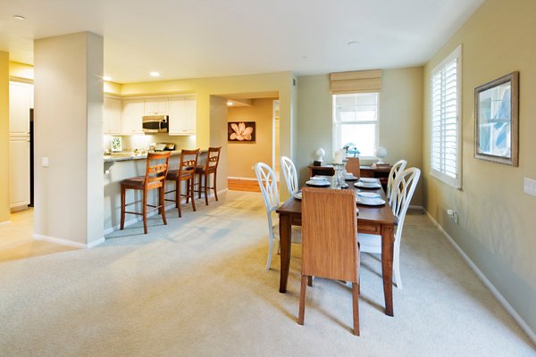 Dining room with elegant decor and seating at Coventry Court Luxury Senior Apartments