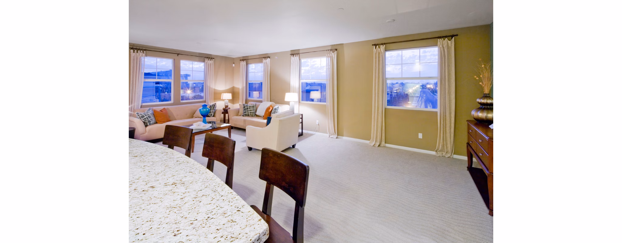 Spacious living room with elegant decor at Coventry Court Luxury Senior Apartments