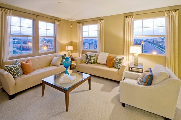 Spacious living room with modern furnishings at Coventry Court Luxury Senior Apartments, ideal for comfortable senior living