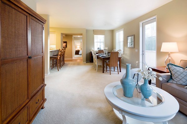 Spacious living room with elegant furnishings at Coventry Court Luxury Senior Apartments