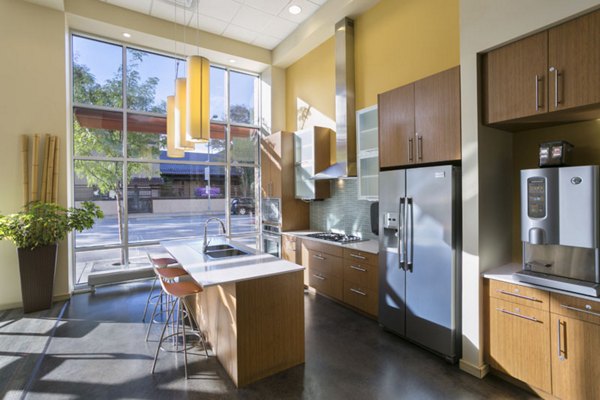 Modern clubhouse with lounge seating and game tables at Solera Apartments
