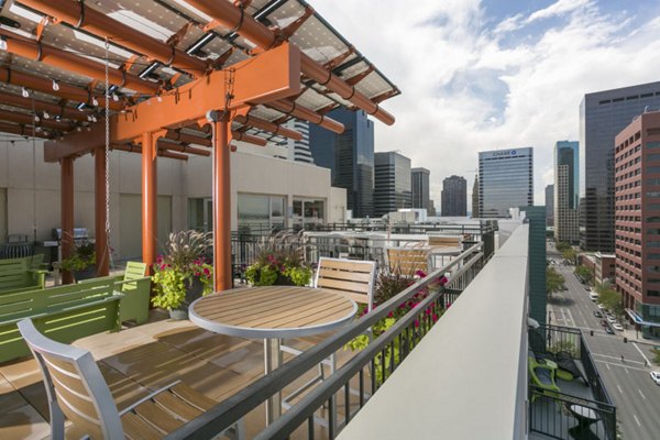 City skyline views from a modern rooftop deck at Solera Apartments