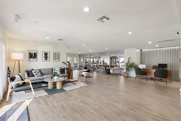 Modern clubhouse with stylish lounge seating and entertainment space at Coventry Park Apartments