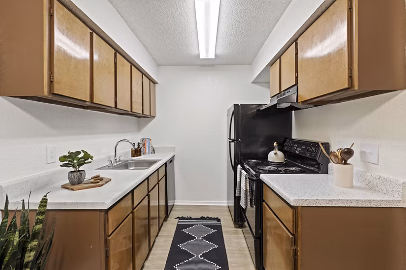 Sleek kitchen with stainless steel appliances at Coventry Park Apartments offering luxury living
