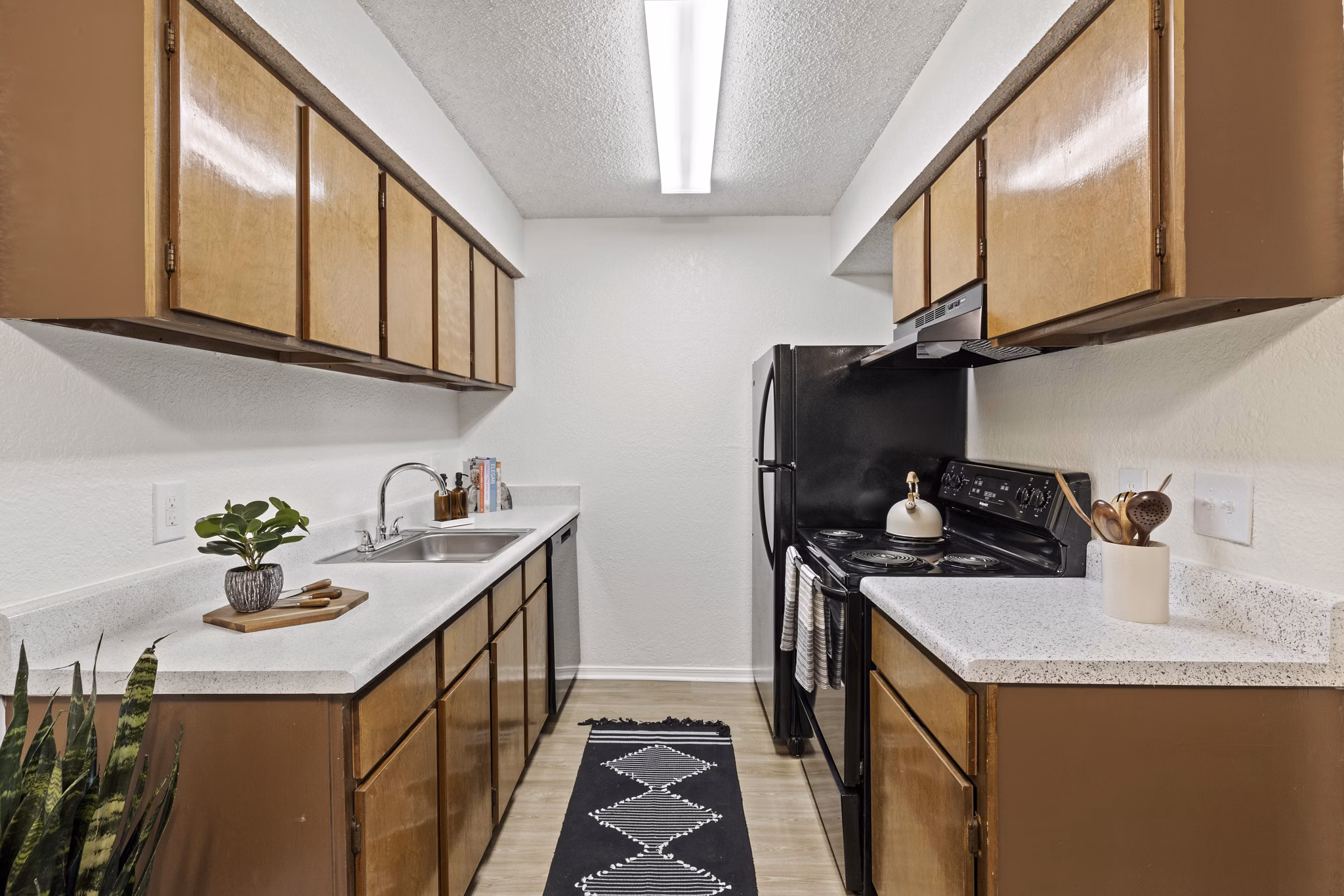 Sleek kitchen with stainless steel appliances at Coventry Park Apartments offering luxury living