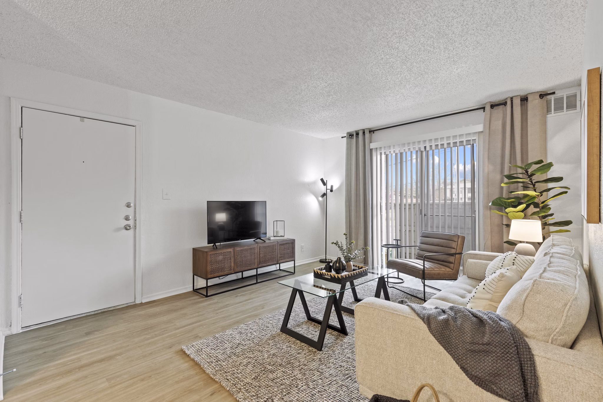 Elegant living room with modern furnishings at Coventry Park Apartments