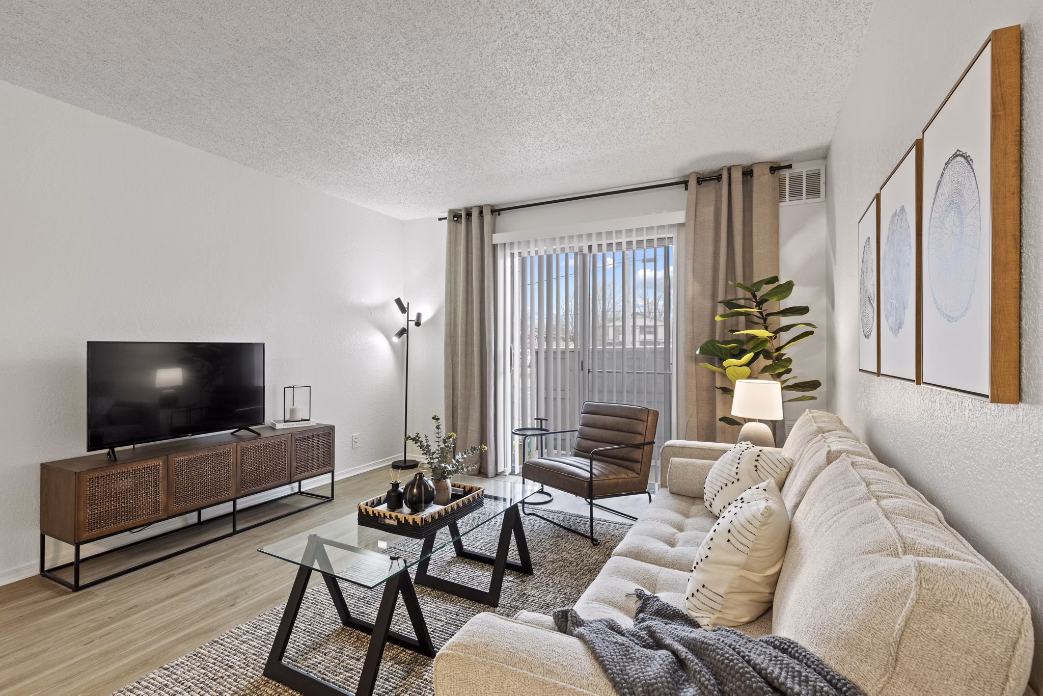 Spacious living room with modern furnishings in Coventry Park Apartments