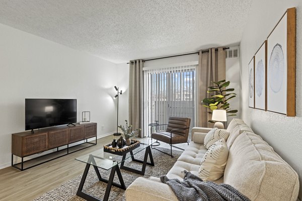 Spacious living room with modern furnishings in Coventry Park Apartments