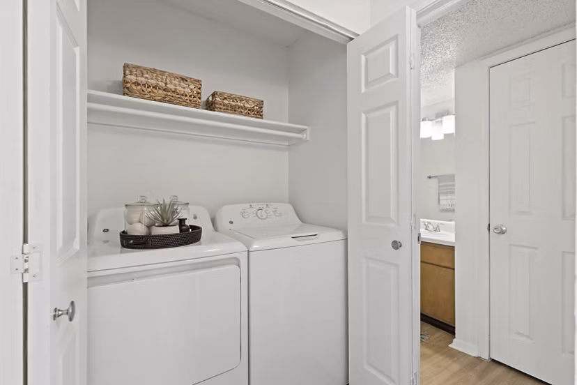 Laundry room with modern appliances in Coventry Park Apartments, Greystar luxury community
