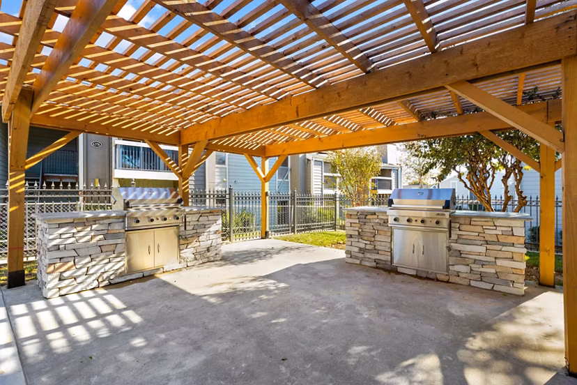 Outdoor grill area with modern seating at Coventry Park Apartments, a luxury community offering premium amenities and comfortable living spaces