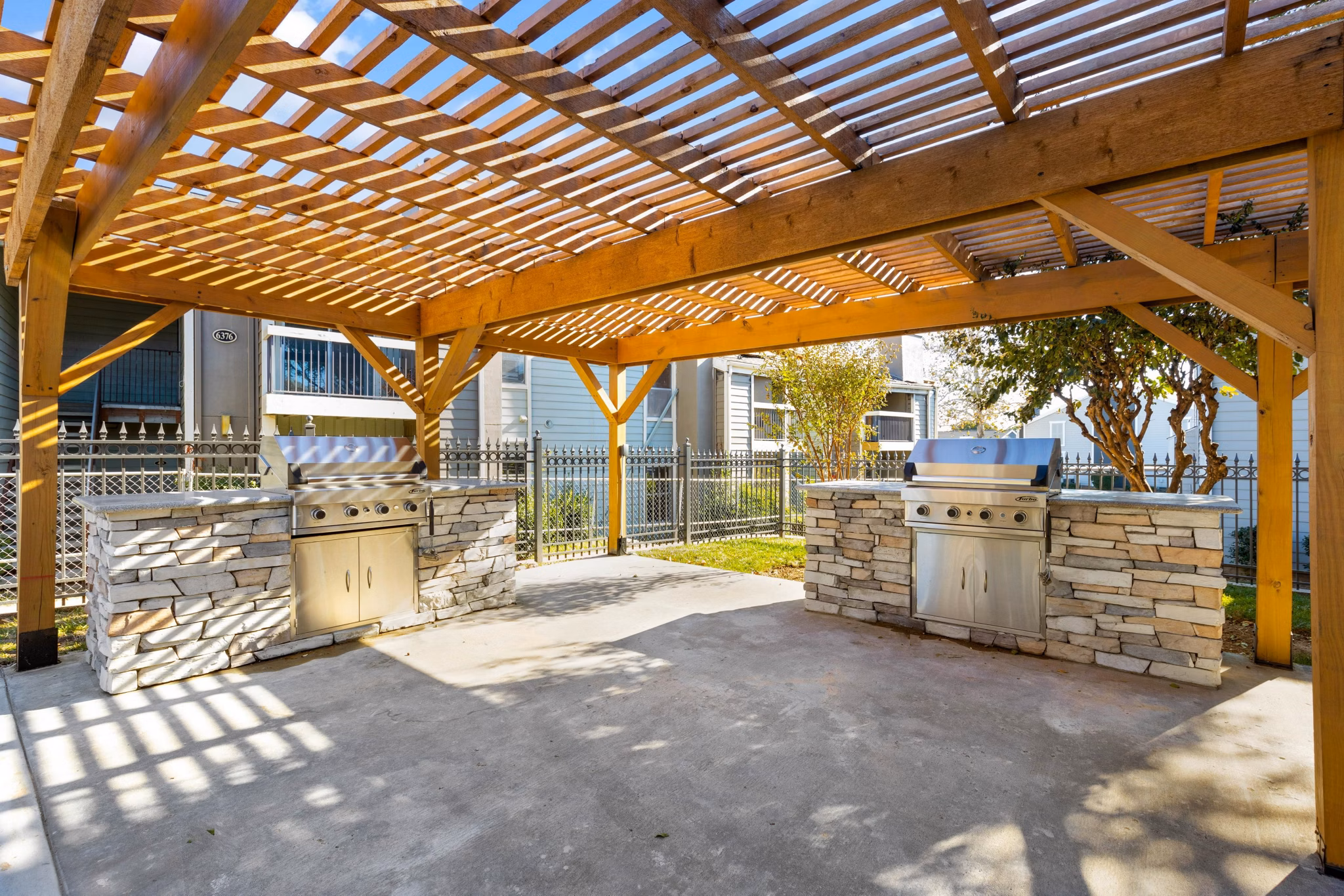 Outdoor grill area with modern seating at Coventry Park Apartments, a luxury community offering premium amenities and comfortable living spaces