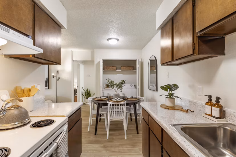 Modern bedroom with stylish furniture in Cascades at Southern Hills Apartments, featuring luxury finishes and large windows for natural light