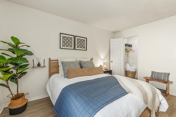 Luxurious bedroom with plush furnishings at Cascades at Southern Hills Apartments